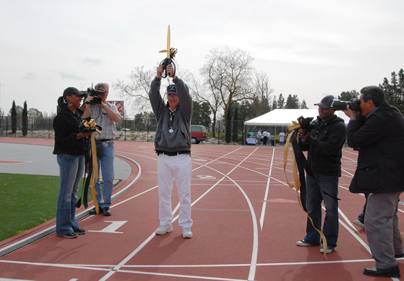 Merv raises the ceremonial scissors!