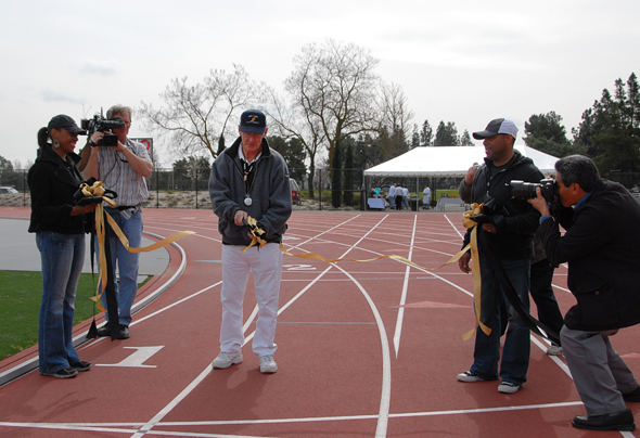 Merv Smith cuts the ribbon at the 