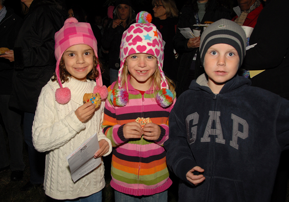 3 kids at tree lighting.