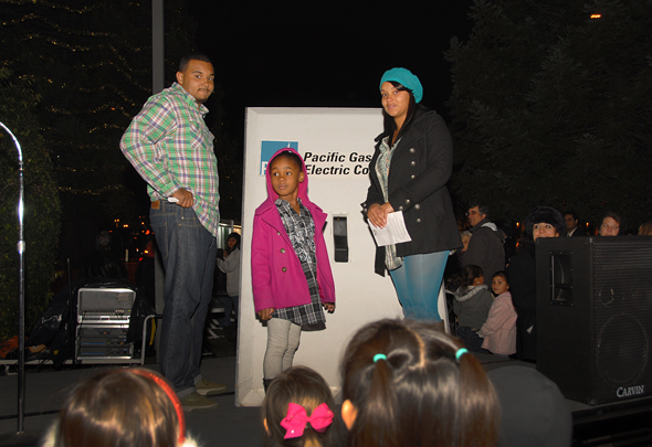 Allison Family gets ready to filp giant PG&E switch to illuminate Delta's Hospice Tree of lights.