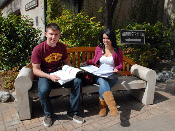 Students sitting on a Delta bench.