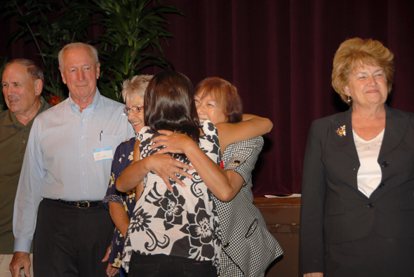 Dr. Elizabeth Blanchard hugs a scholarship recipient!