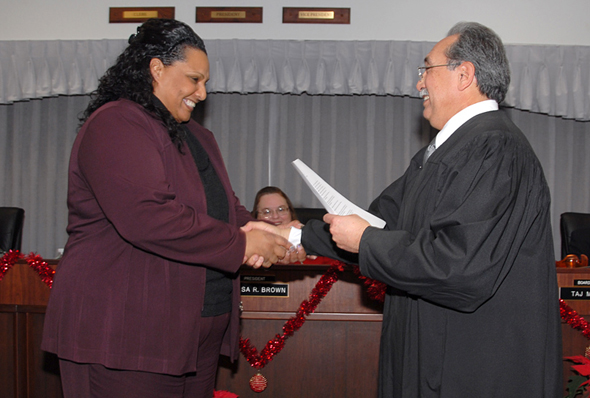 Delta College Trustee Lisa Turner, representing Area 7, Manteca-Escalon, shakes hands with Judge Jose Alva after her swearing in ceremony.