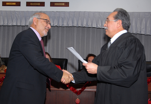 Taj M. Khan renews his oath of office as a Delta trustee for Lodi.