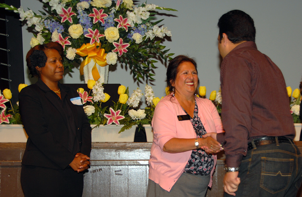 Student Trustee Donna Armstrong and Trustee Janet Rivera greet an award recipient.