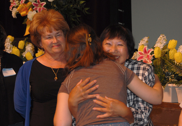 Trustee Mary Ann Cox and Dr. Elizabeth Blanchard greet a scholarship recipient.