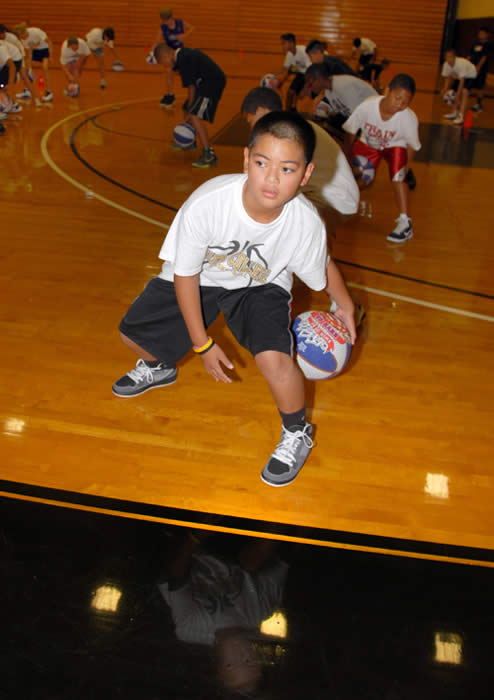 Student practices dribbling