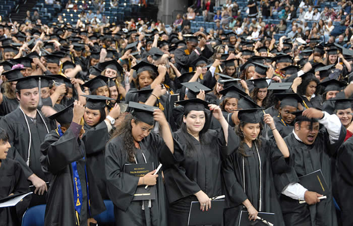 Students move their tassels to the left side of their Mortar Boards.