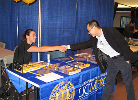 College Night at Delta College. A U.C. Merced rep meets a prospective student.