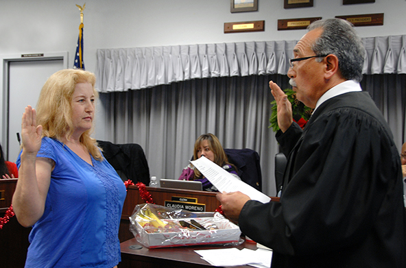 Catherine Mathis, M.D., takes oath of office from Judge Jose L. Alva.