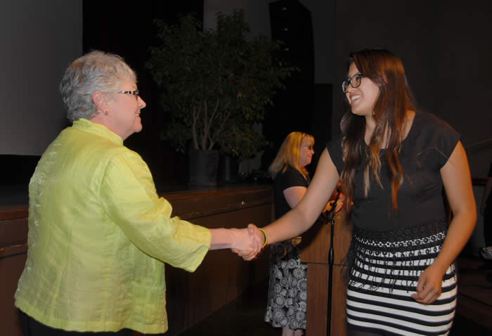 Dr. Kathy Hart gongratulates a scholarship recipient.