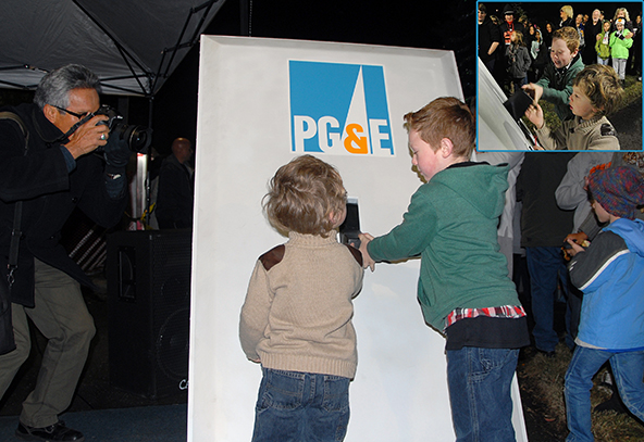 Spencer and Samuel McAlister flip the giant PG&E switch to light the 2015 Tree of Lights!