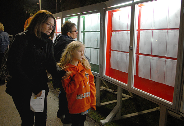 Hospice donors find a loved one's name on the marquee under the Hospice Tree of Lights.