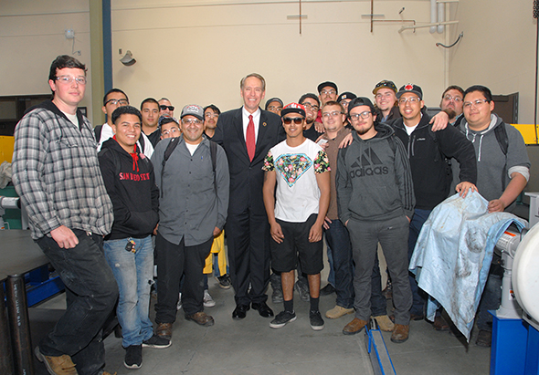 Chancellor Harris shares a photo op with Delta College Heavy Equipment/Diesel Students