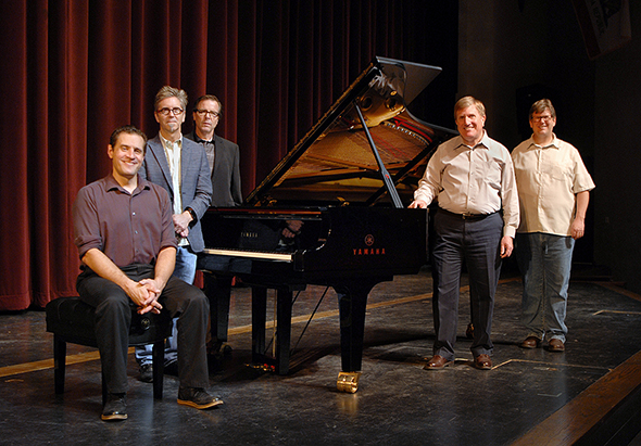 Delta College Staff Stand next to a new Yamaha CFX Grand Piano