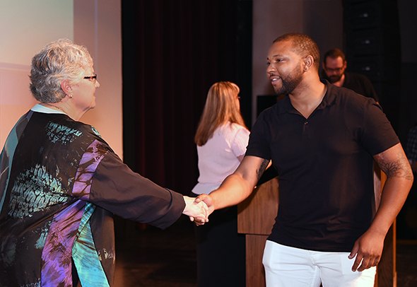 Superintendent/President Dr. Kathy Hart greets a scholarship recipient.